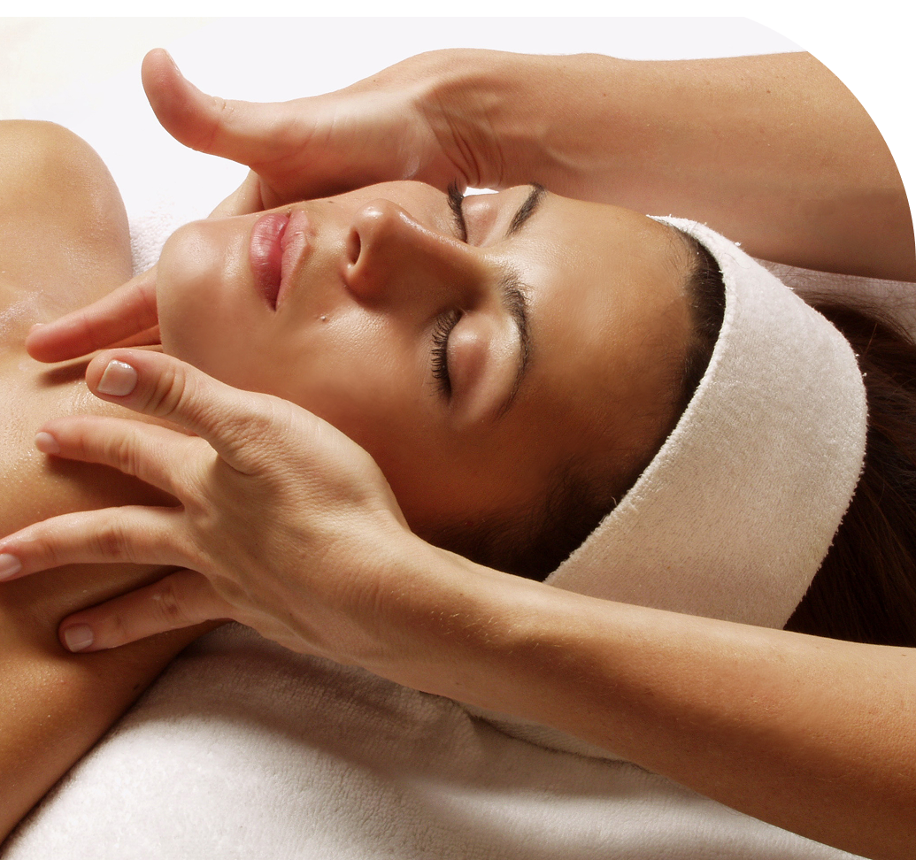 Facial massage therapy with white headband.