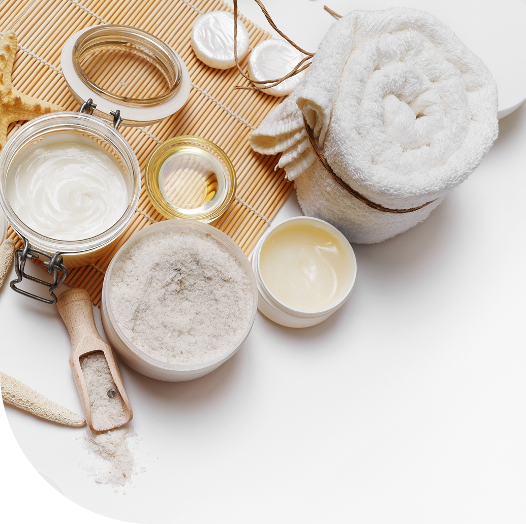 Spa essentials on a bamboo mat.