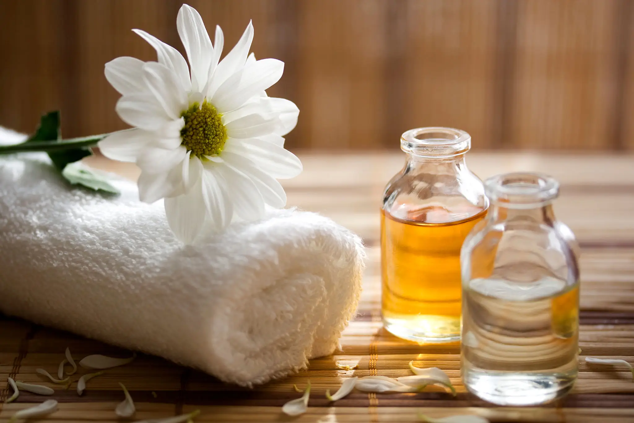 Spa essentials with towel and oils